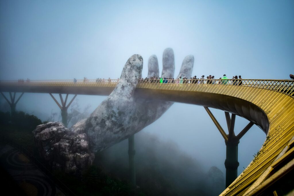 a bridge that has a giant hand on it